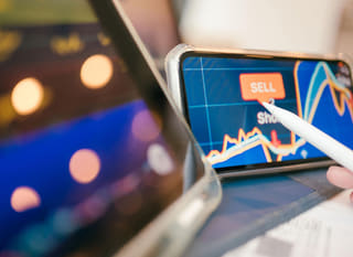 Trader examining Bitcoin, Ethereum, and forex trading options across multiple markets